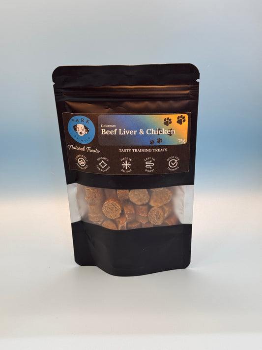 Black package of dog treats with visible contents on a white background